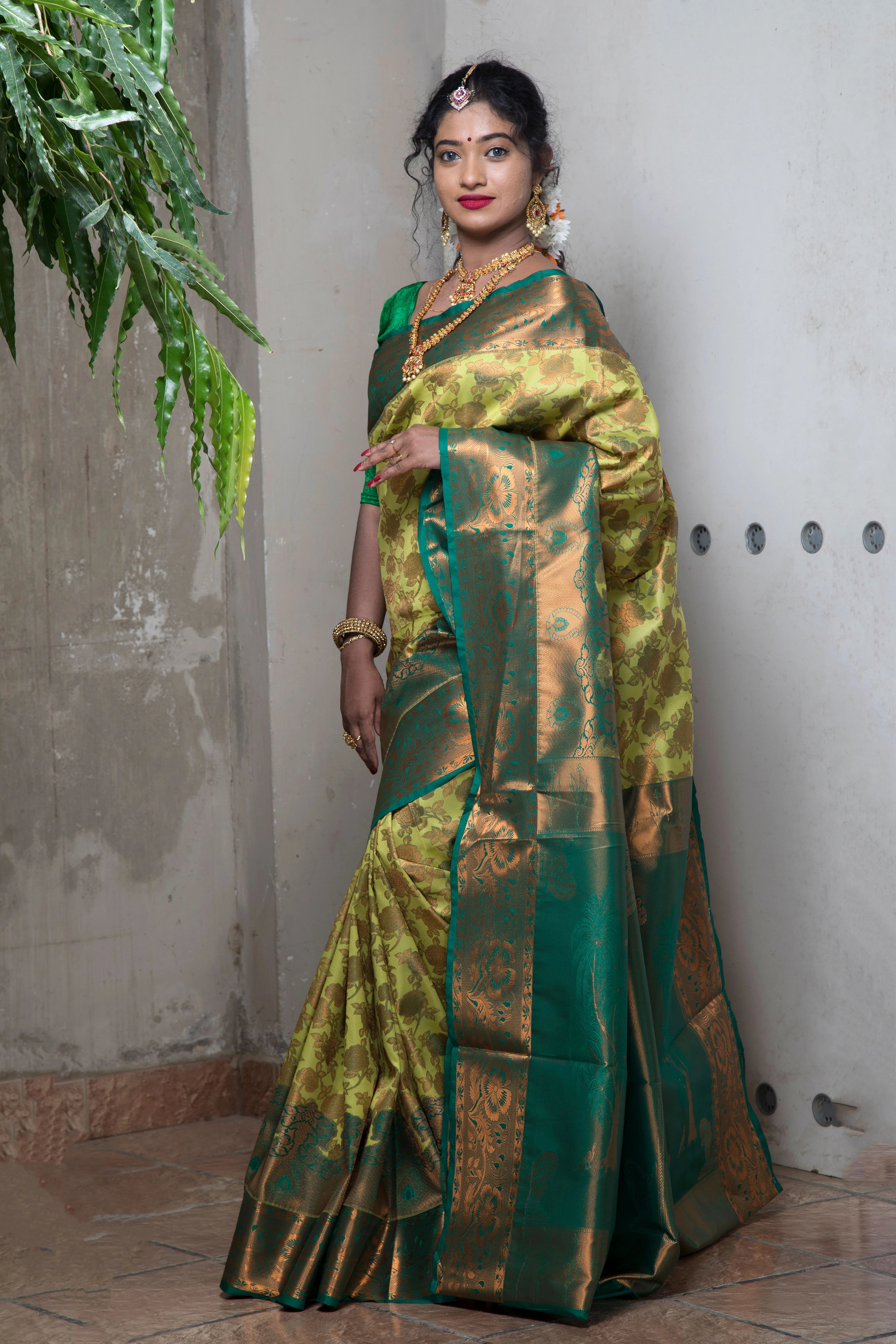Emerald saree with a golden border