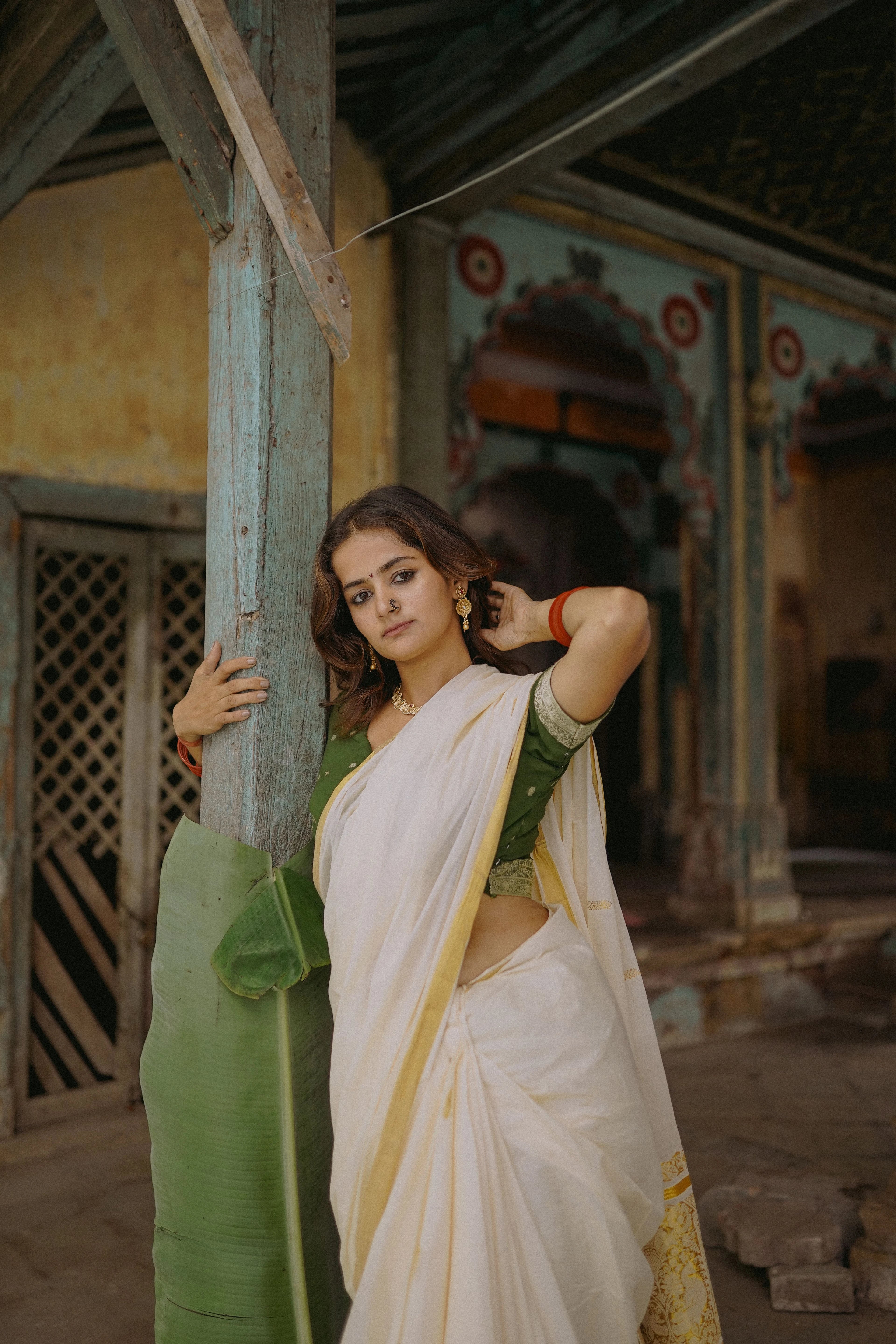 Ivory saree styled with a green blouse